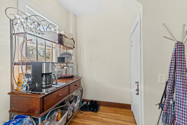 interior space featuring plenty of natural light and hardwood / wood-style floors