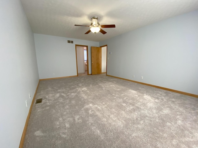 unfurnished bedroom with ceiling fan and carpet flooring