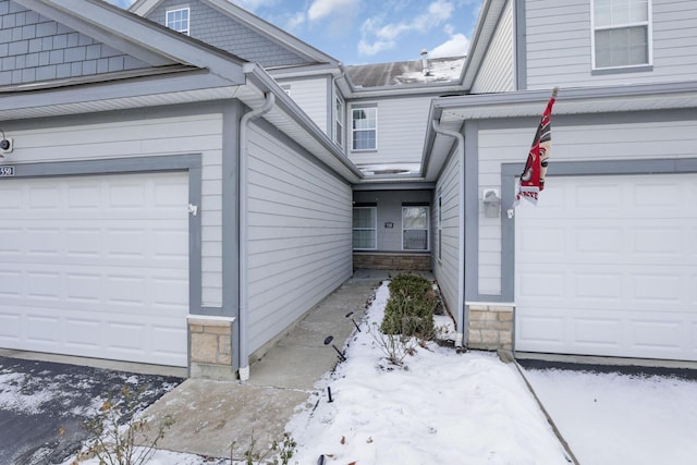 view of snow covered property entrance