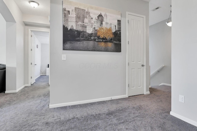 hallway featuring carpet flooring