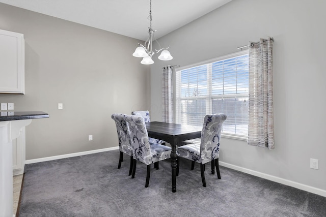 carpeted dining area featuring a wealth of natural light, vaulted ceiling, and an inviting chandelier