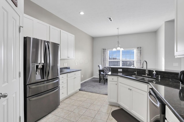 kitchen with sink, white cabinets, and appliances with stainless steel finishes