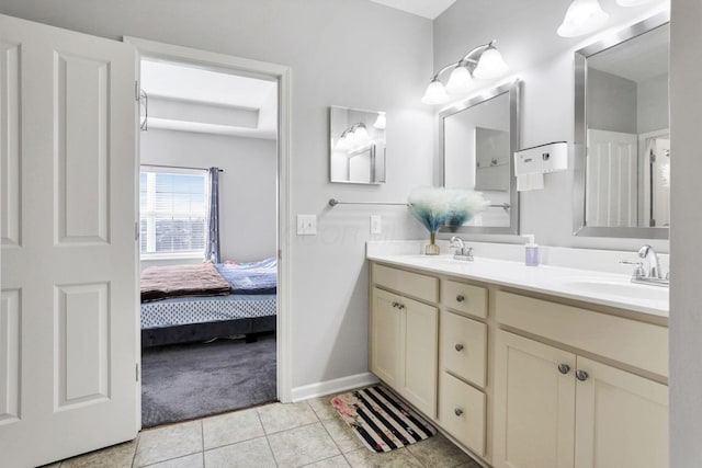 bathroom with tile patterned floors and vanity