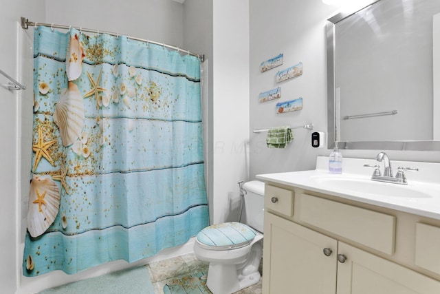 bathroom with vanity, toilet, and curtained shower