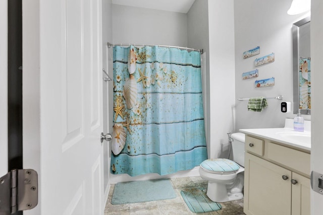 bathroom with toilet and vanity