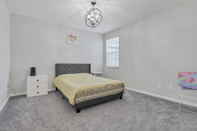 carpeted bedroom with a chandelier