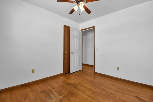 spare room with light hardwood / wood-style floors and ceiling fan