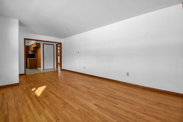 unfurnished living room with light hardwood / wood-style flooring