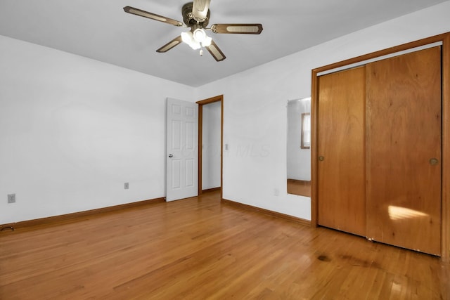 unfurnished bedroom with a closet, ceiling fan, and light hardwood / wood-style floors