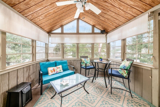 sunroom / solarium featuring vaulted ceiling, wooden ceiling, and ceiling fan