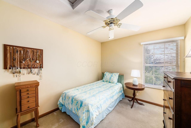 carpeted bedroom featuring ceiling fan