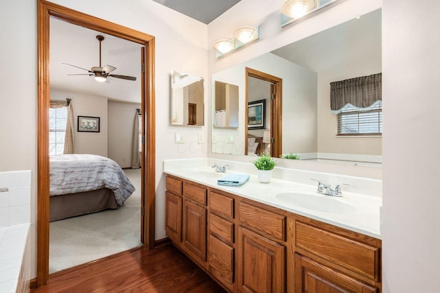 bathroom featuring vanity, wood-type flooring, and ceiling fan