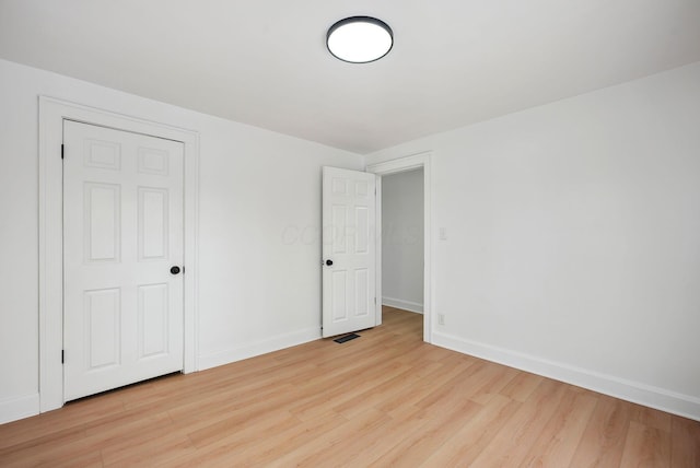 spare room with light wood-type flooring