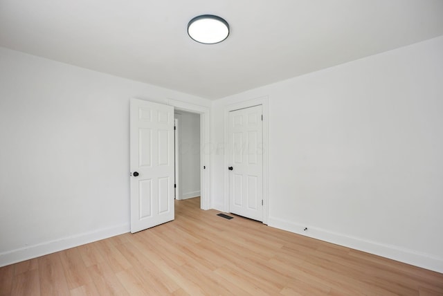 spare room featuring light hardwood / wood-style floors