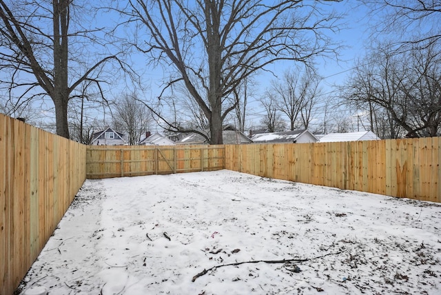 view of yard layered in snow