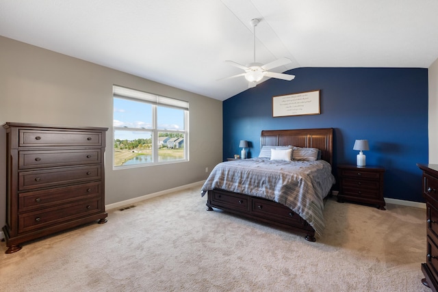 carpeted bedroom with lofted ceiling and ceiling fan