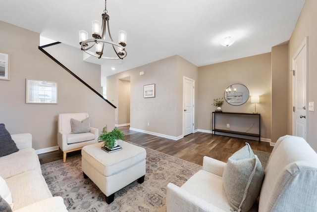 living room with hardwood / wood-style floors and a chandelier