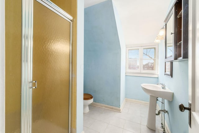 bathroom with walk in shower, tile patterned floors, and toilet