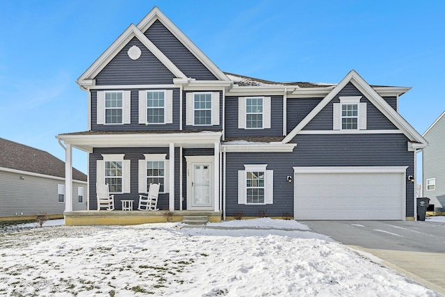 view of front of property with a garage and a porch