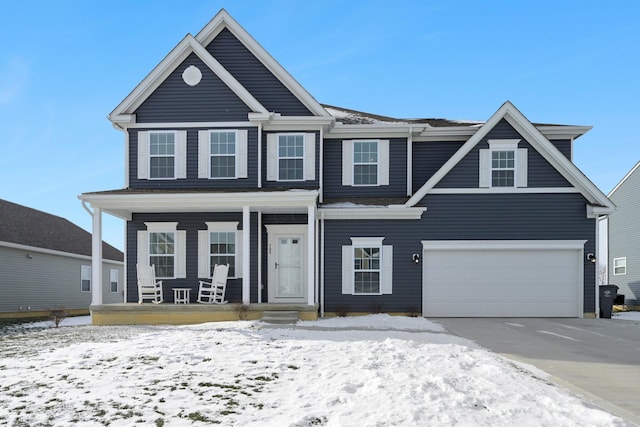 view of front of home featuring a garage and a porch