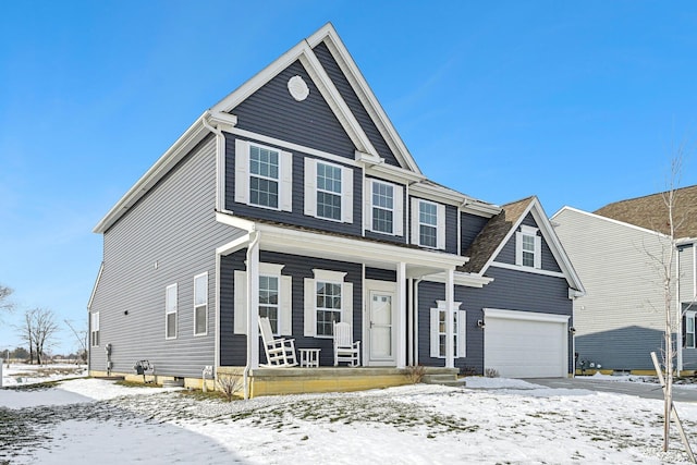 view of front of home with a garage and a porch