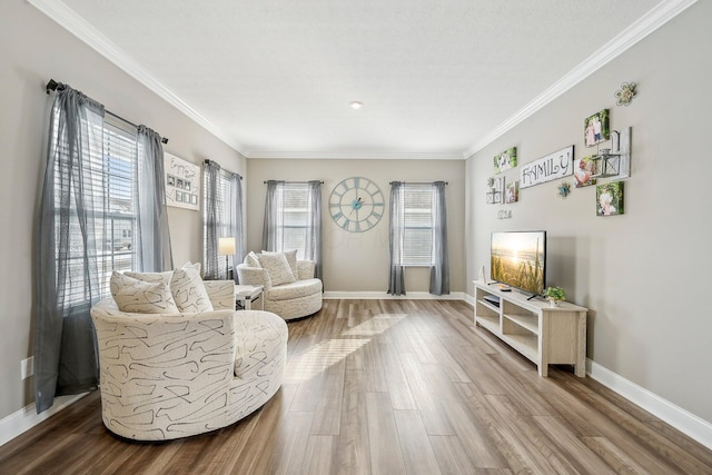 living room featuring hardwood / wood-style flooring and ornamental molding