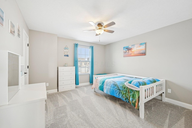 bedroom with ceiling fan and light colored carpet