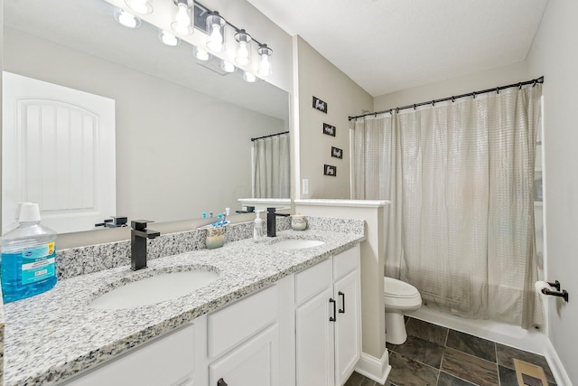 full bathroom featuring toilet, vanity, and shower / tub combo with curtain