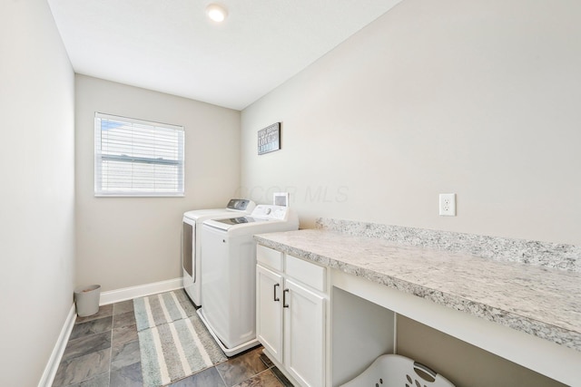 laundry area featuring cabinets and washing machine and dryer