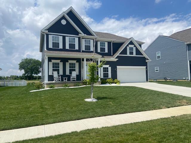 509 Walker Pointe Dr, Commercial Point, OH 43116 - craftsman inspired home with concrete driveway, a garage, and covered porch