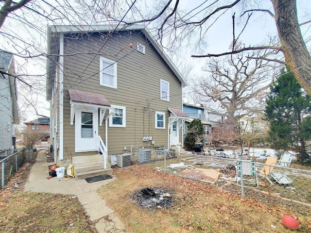 rear view of property with central air condition unit