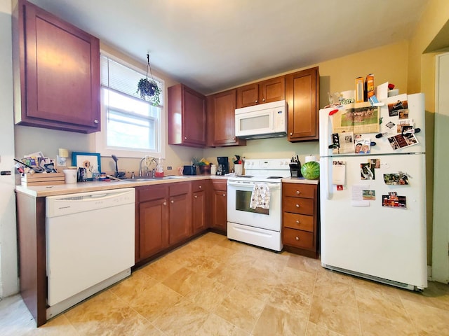 kitchen featuring sink and white appliances