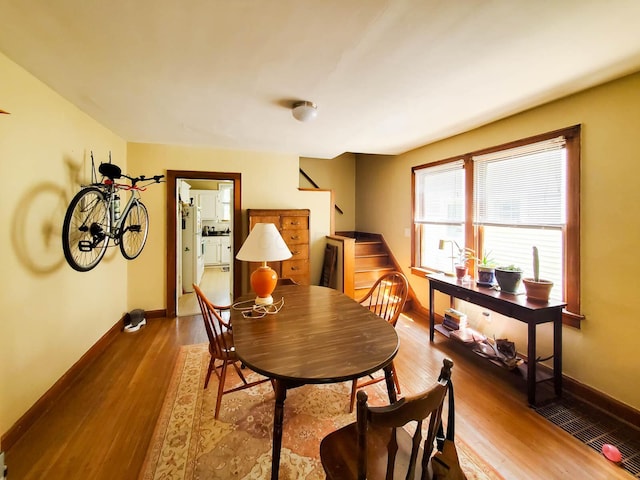 dining room with hardwood / wood-style flooring