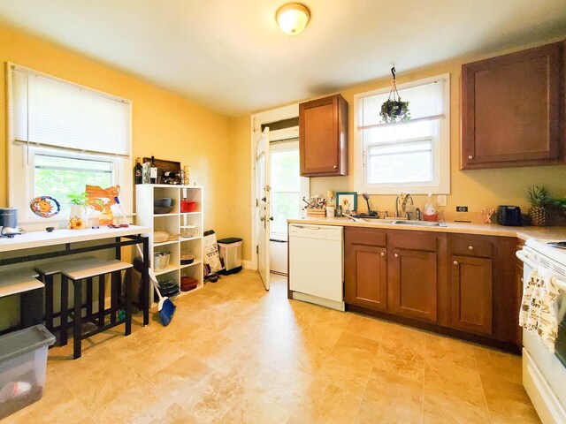 kitchen with white appliances and sink