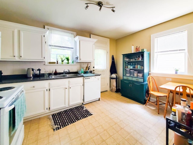 kitchen with white cabinetry, sink, white appliances, and backsplash