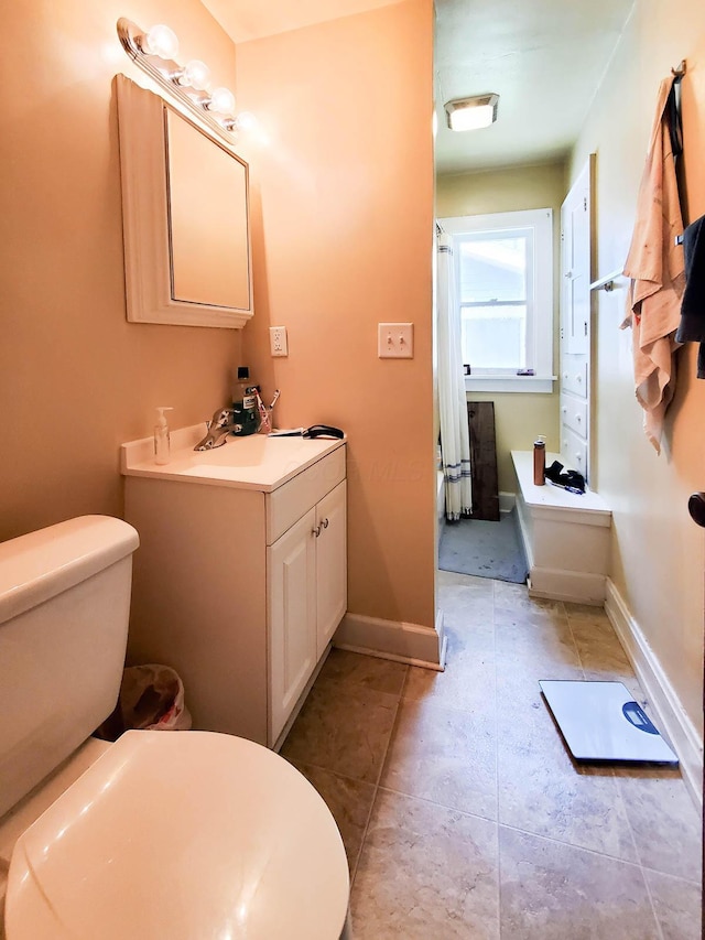 bathroom featuring vanity and toilet