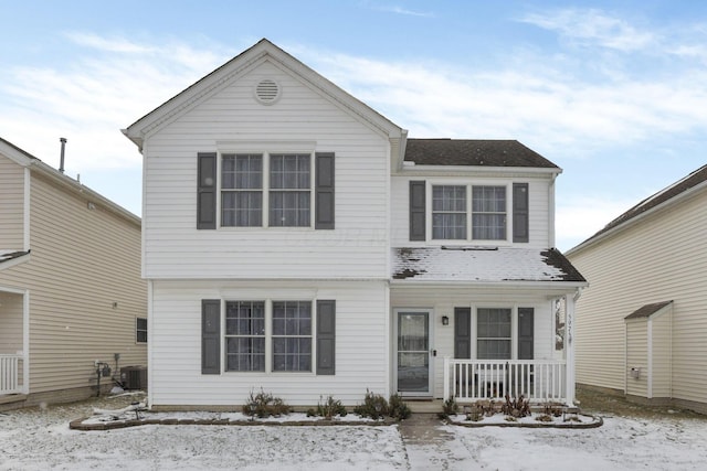 front of property featuring covered porch and central AC