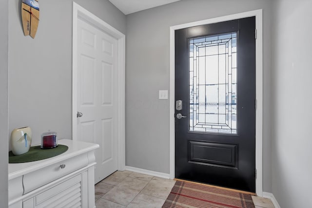 foyer with light tile patterned floors