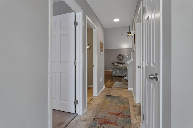 corridor with light tile patterned flooring