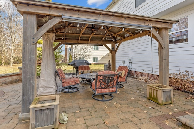 view of patio / terrace featuring a gazebo and outdoor dining space