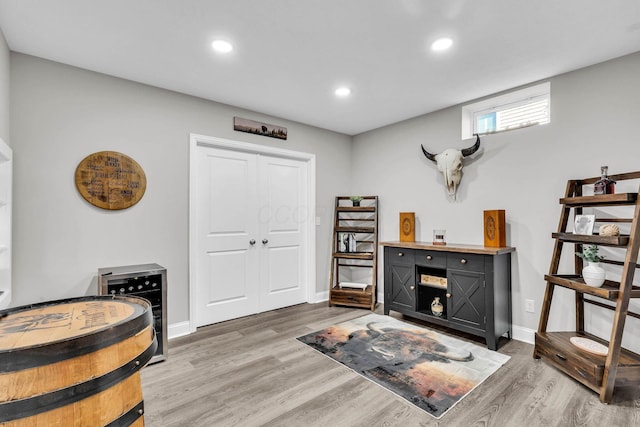 interior space with recessed lighting, baseboards, and wood finished floors