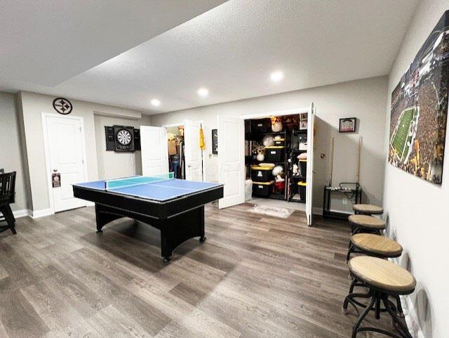 recreation room featuring baseboards, dark wood-style floors, pool table, a textured ceiling, and recessed lighting