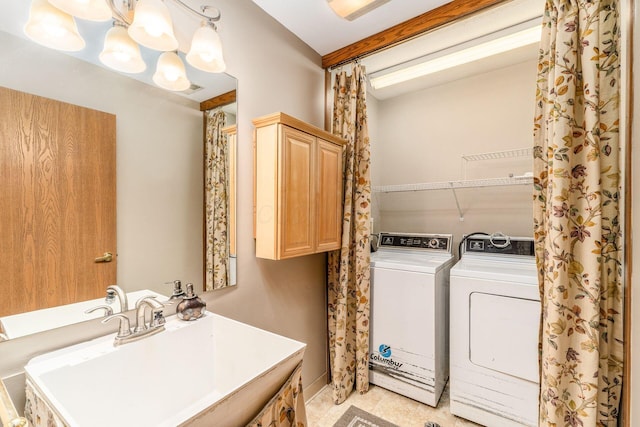 bathroom featuring sink, separate washer and dryer, and tile patterned floors