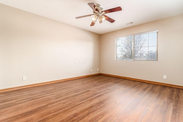 unfurnished room featuring hardwood / wood-style flooring and ceiling fan