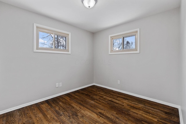 unfurnished room featuring dark hardwood / wood-style floors