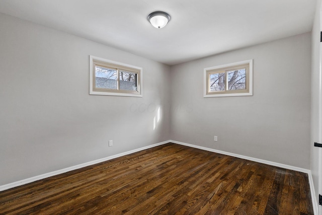 empty room featuring dark hardwood / wood-style floors