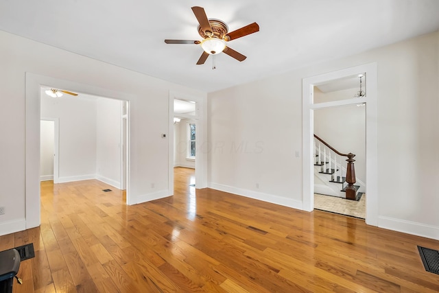 unfurnished room featuring ceiling fan and light hardwood / wood-style flooring