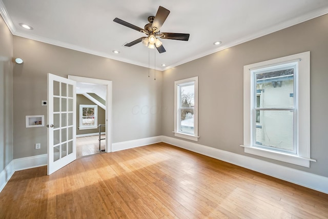 spare room featuring crown molding, light hardwood / wood-style flooring, and ceiling fan