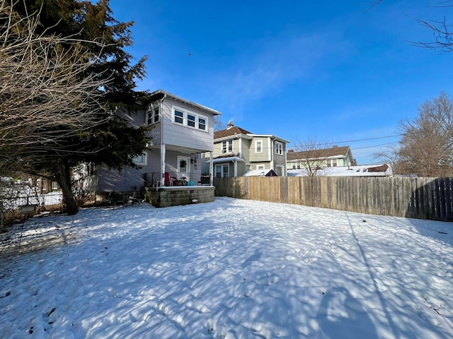 view of yard covered in snow