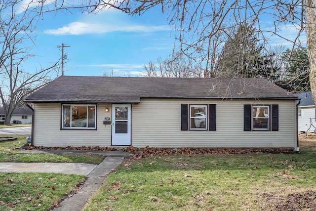 single story home with a front yard